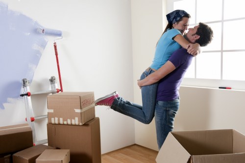 Removal team loading boxes for a house move in Enfield