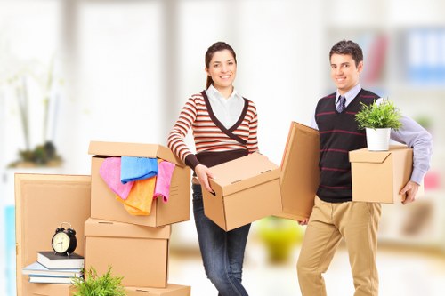 Careful loading of office furniture for collection in Enfield