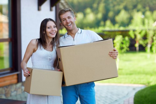 Professional removals team handling household items