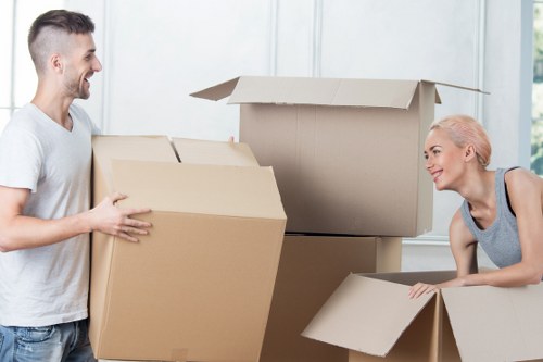Careful handling of household items during a move in Enfield
