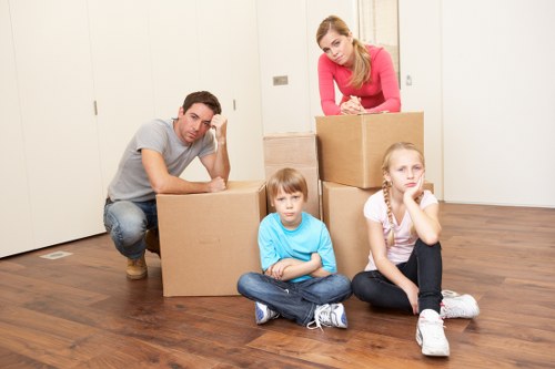 Unpacking support in an Enfield home with labelled boxes