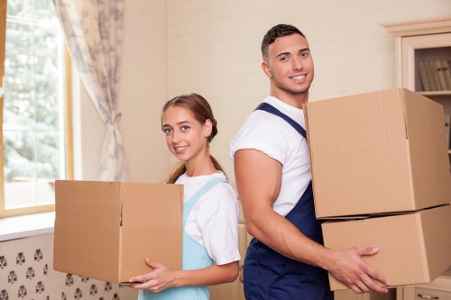 Furniture and boxes being loaded into a removals van