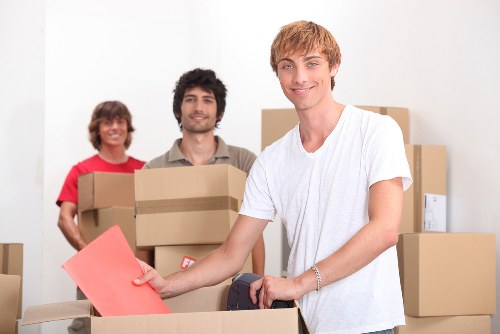 Movers loading household items for an Enfield move